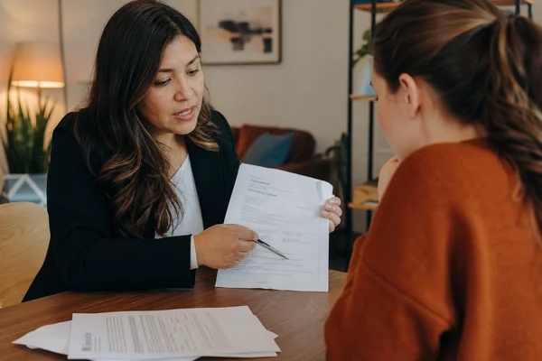 Fort Worth Second Chance Apartments locator reviewing income documents with first time renter